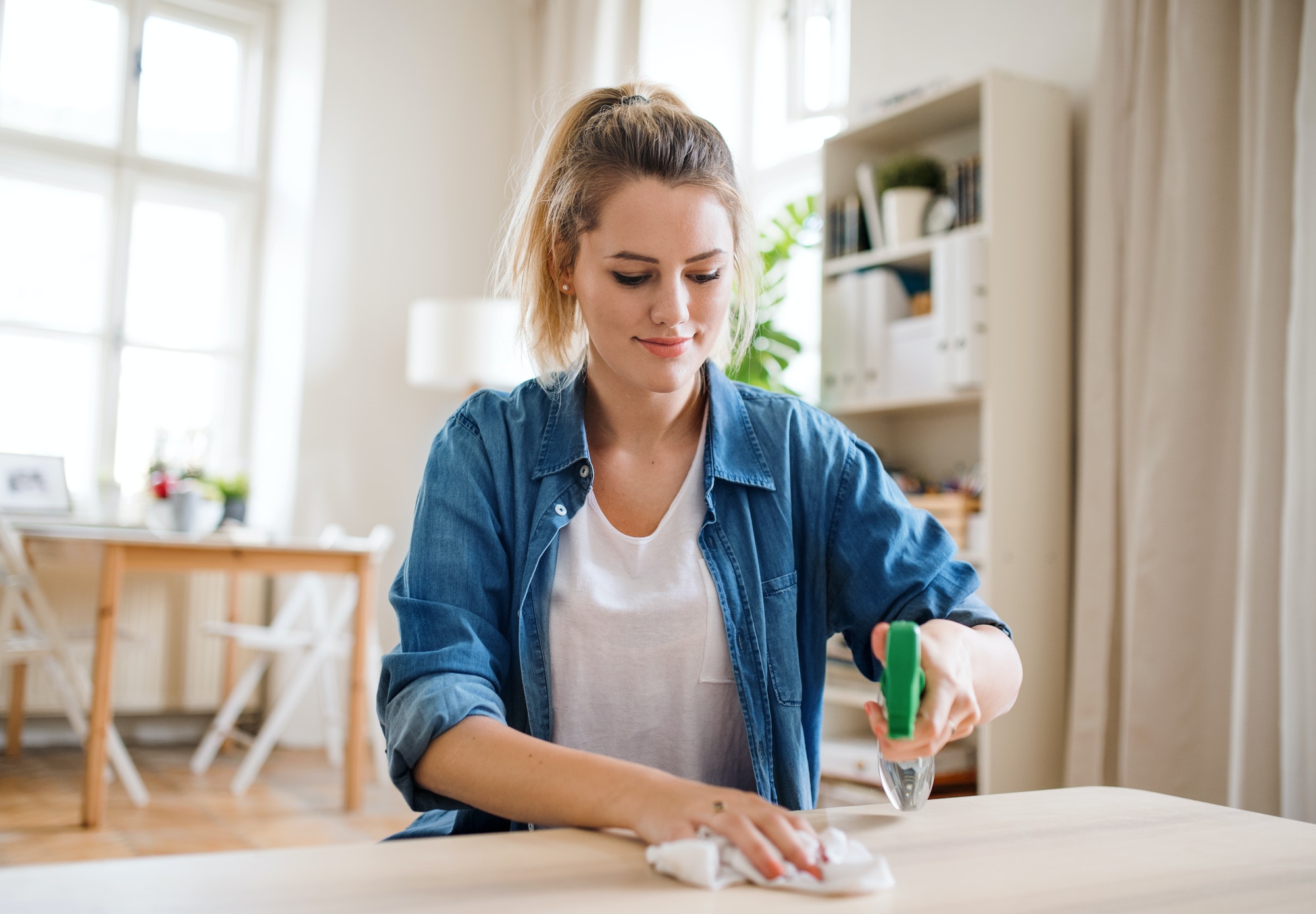 young-woman-indoors-at-home-cleaning-table-.jpg young-woman-indoors-at-home-cleaning-table-.jpg